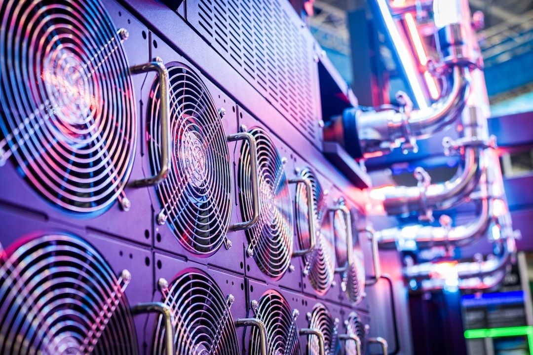 Rows of server cooling fans and illuminated data-center equipment